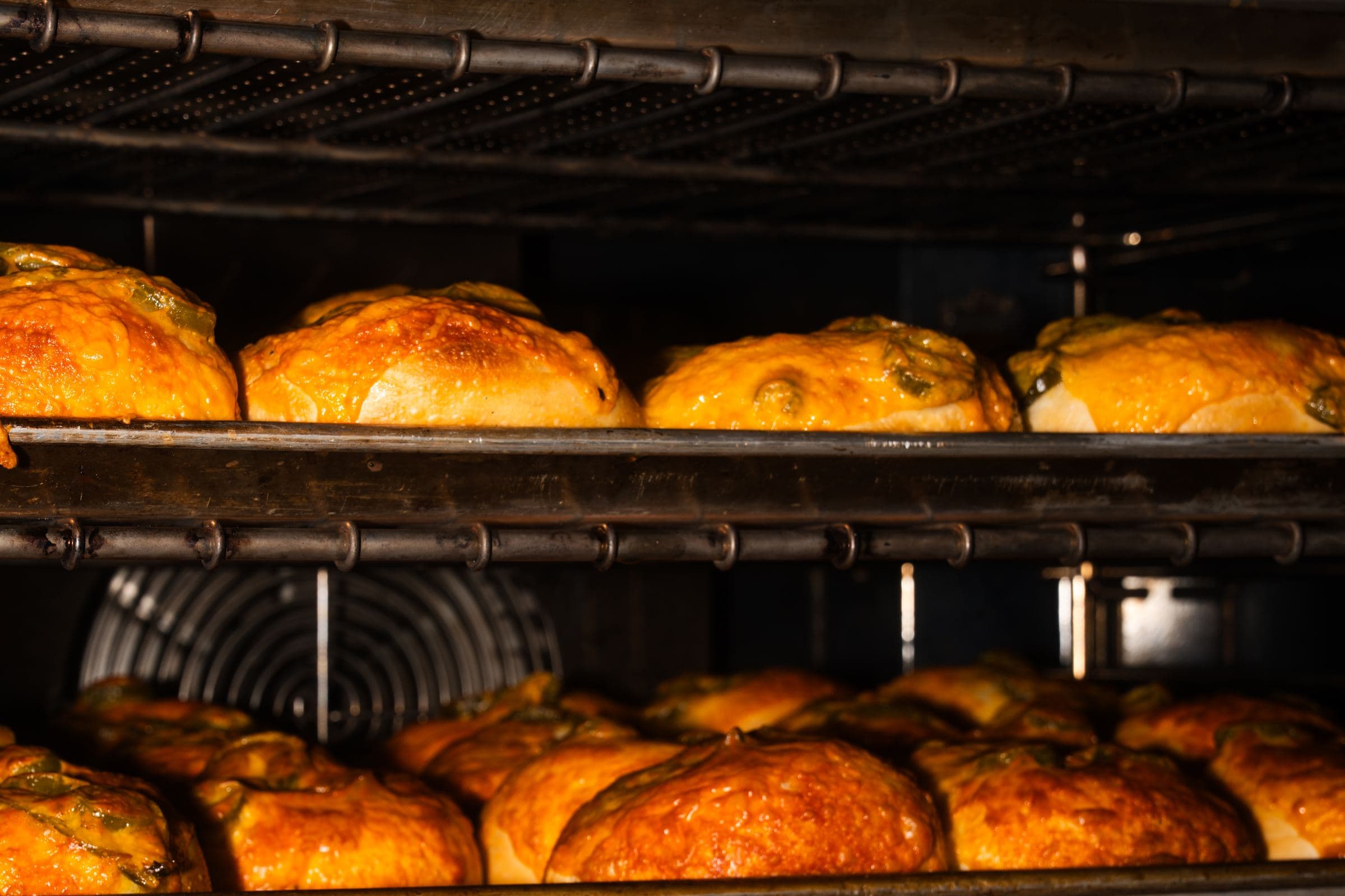 Trays of fresh Jaded bagels coming out of the oven